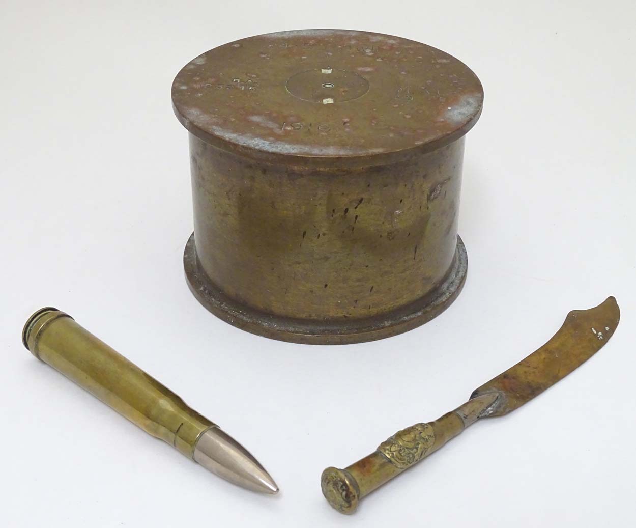 Militaria : An assortment of three items of WWI & WWII memorabilia,