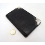 A black leather wallet having silver mounts hallmarked Birmingham 1902 maker Adolph Frankau & Co