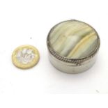 A silver plate pill box of circular form with agate cabochon to top 1 3/4" diameter