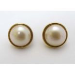 A pair of silver gilt pearl stud earrings.