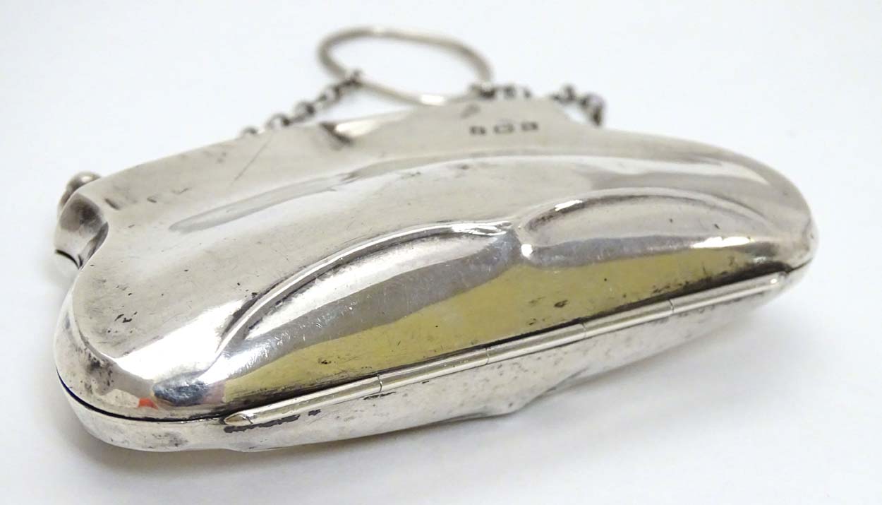 A silver purse with brown leather interior. Hallmarked Birmingham 1909. - Image 9 of 14