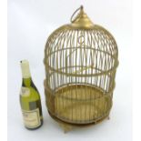An early - mid 20thC brass domed shaped hanging bird cage.