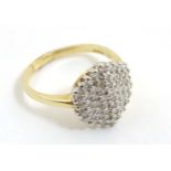 A 9ct gold ring set with diamond cluster CONDITION: Please Note - we do not make