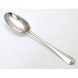 A Queen Anne Britannia Standard silver Hanoverian table spoon with rat tail bowl.