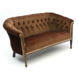 An Edwardian mahogany button back two and half seat sofa with inlaid hairbell and stringing etc