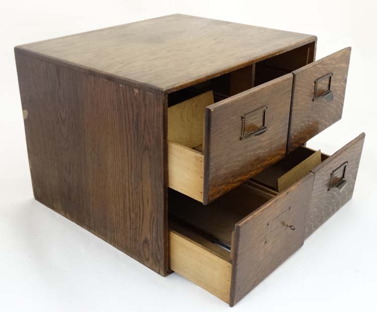 An early 20th C oak four drawer table top filing cabinet, with sliding sections within, - Image 4 of 7