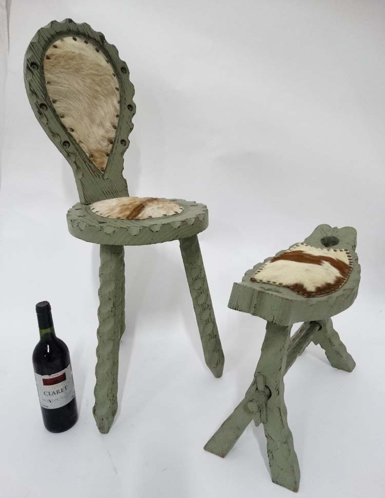 Green painted cowhide upholstered single spinning chair with a matching foot stool