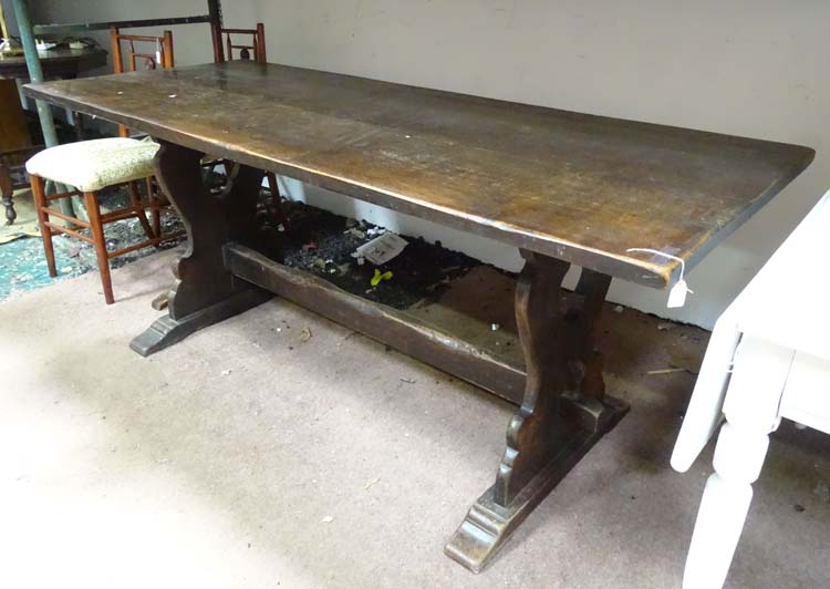 An oak refectory dining table CONDITION: Please Note - we do not make reference to