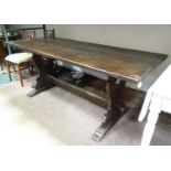 An oak refectory dining table CONDITION: Please Note - we do not make reference to