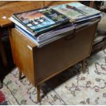 A large quantity of records together with a record cabinet,to include titles by The Beatles, Elvis,