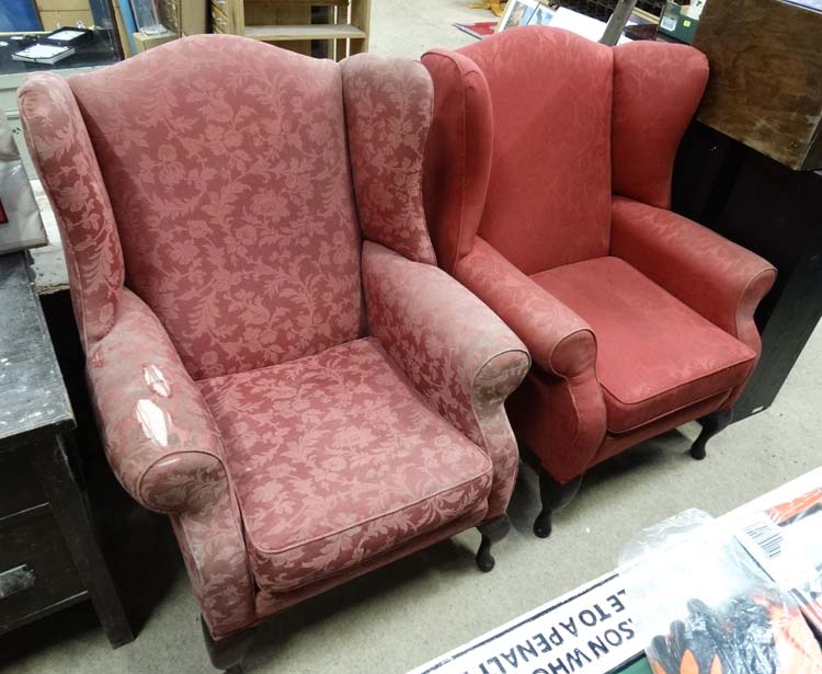 A pair of upholstered wing back armchairs for restoration CONDITION: Please Note -