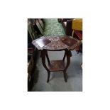 An Art Deco carved occasional table CONDITION: Please Note - we do not make