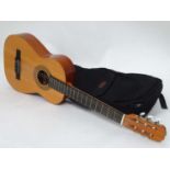 A classical guitar and case made BM in Spain