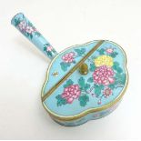 An oriental enamel decorated quatrefoil lidded box with handle and peony decoration 5" wide
