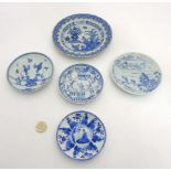 5 Chinese plates : a blue and white plate depicting a rock with butterflies and peonies on a