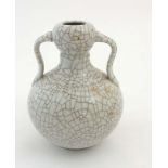 A Chinese double gourd Ge ware vase with ruyi shaped handles,