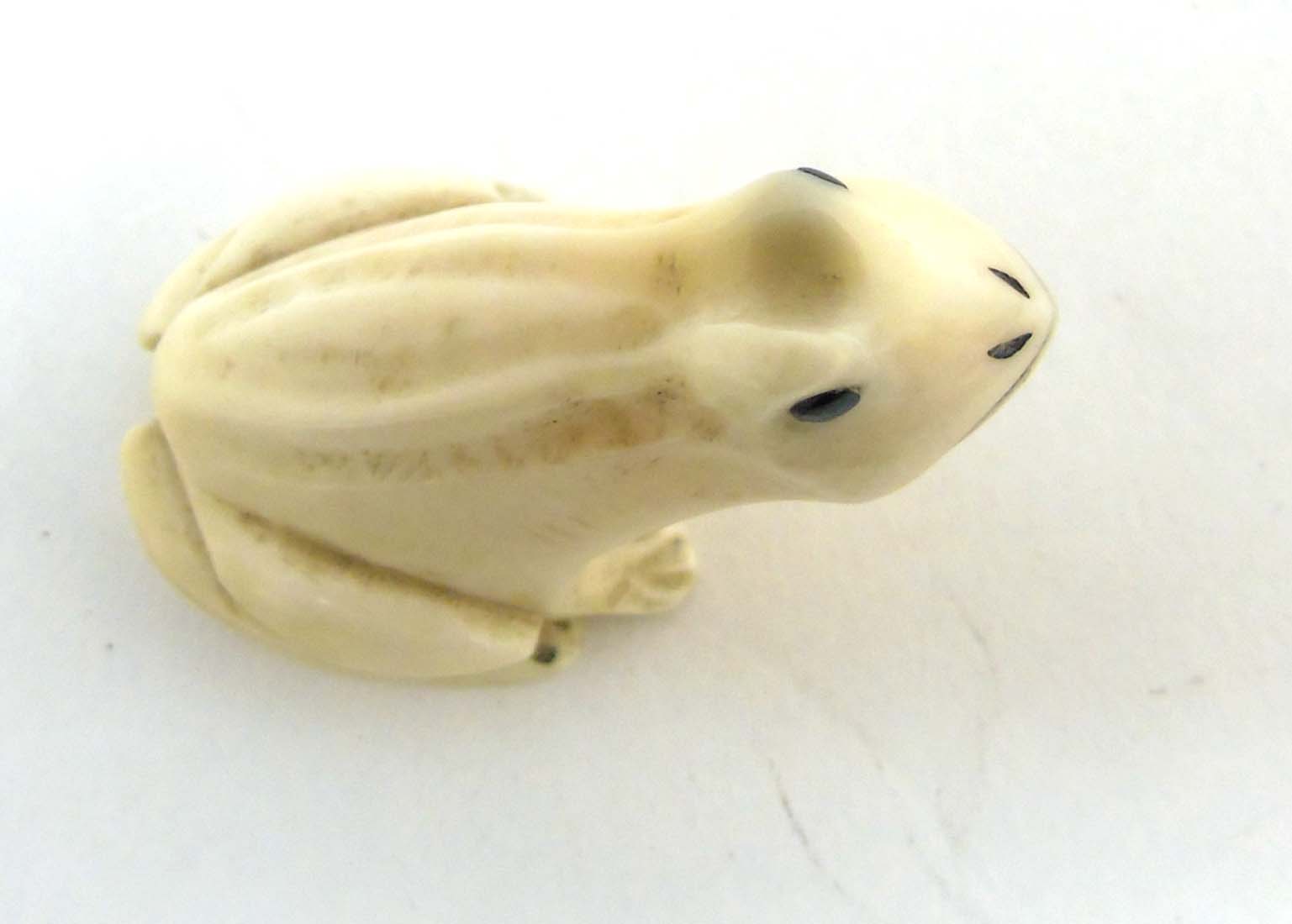 A Japanese Meiji period signed ivory netsuke formed as a frog with black eyes. - Image 7 of 8