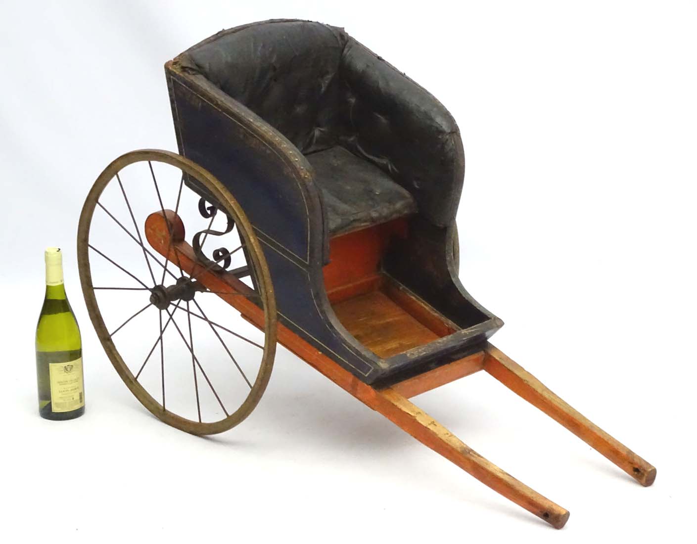 A Victorian Dog Cart with upholstered button back leather seat, hand painted wooden shafts,
