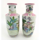 A pair of Famille Rose Rouleau vases,