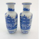 A pair of Chinese blue and white Rouleau vases,