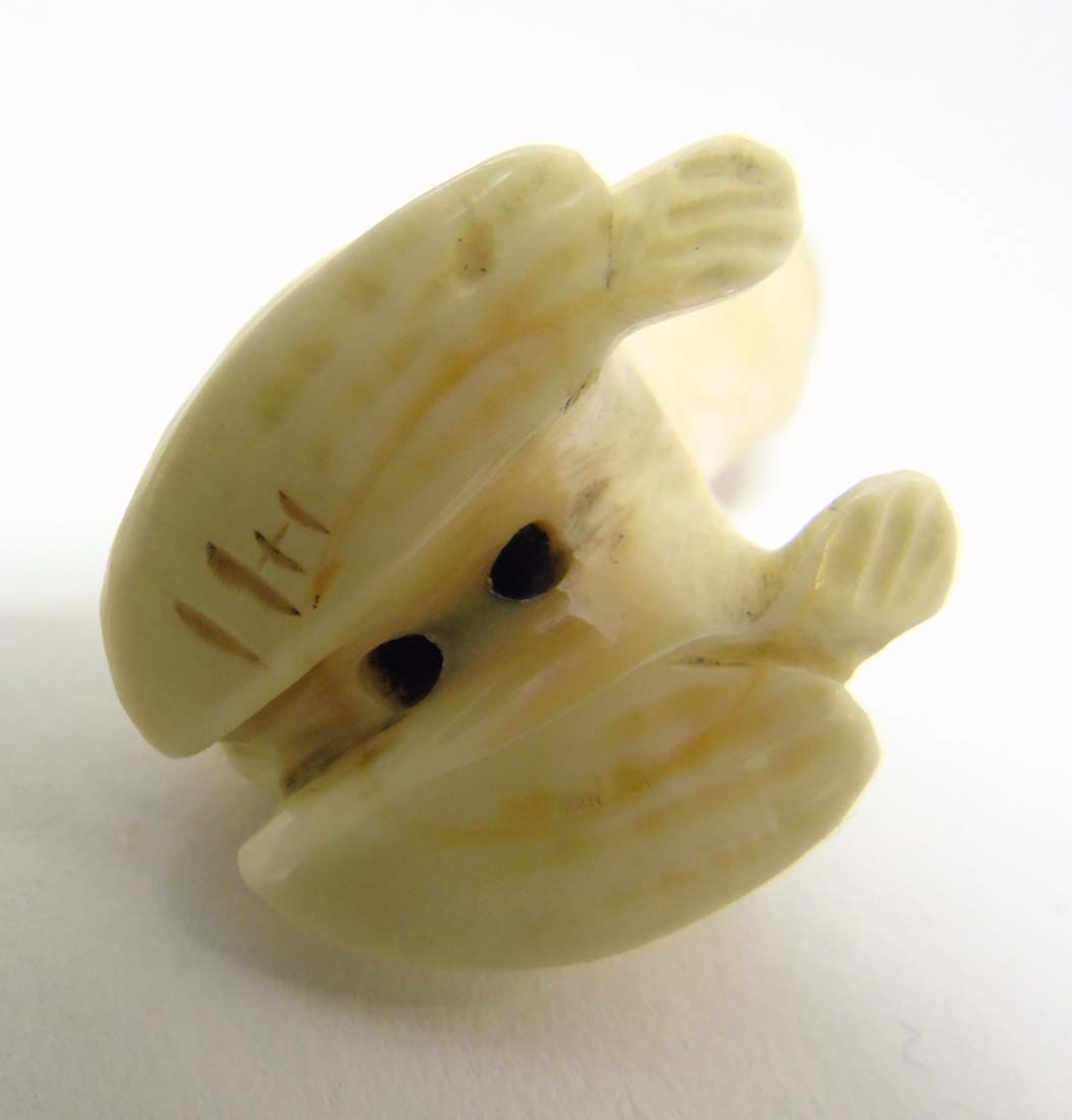 A Japanese Meiji period signed ivory netsuke formed as a frog with black eyes. - Image 2 of 8