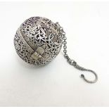 A Chinese white metal Sensor Ball with pierced decoration of birds etc 2 1/4" diameter