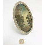 C.1900 Oil on card, landscape scene within an oval silver plate adjustable easel / strut frame.