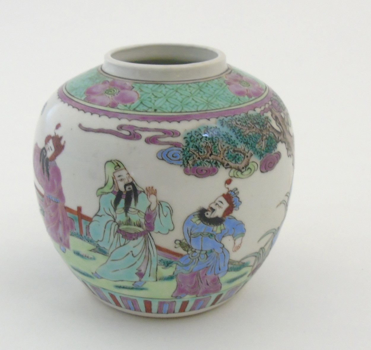 A Chinese Famille Verte ginger jar decorated in enamels of green, pink, purple and blue,