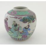 A Chinese Famille Verte ginger jar decorated in enamels of green, pink, purple and blue,