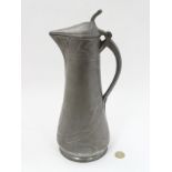 Art Nouveau : an early 20thC Pewter claret jug , possibly an un-marked Orivit , measures 13” high.