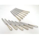 A set of 12 silver handled table knives Hallmarked Sheffield 1965/66 maker William Yates Ltd.