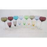 Retro glass: A set of 8 coloured German Hock wine glasses together with a set of 6 smaller pedestal