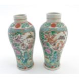 A pair of Chinese Cantonese baluster vases,