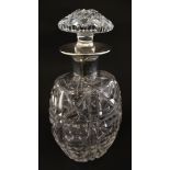 A cut glass decanter with silver collar hallmarked Sheffield 1956 maker Cooper Brothers & Sons Ltd.