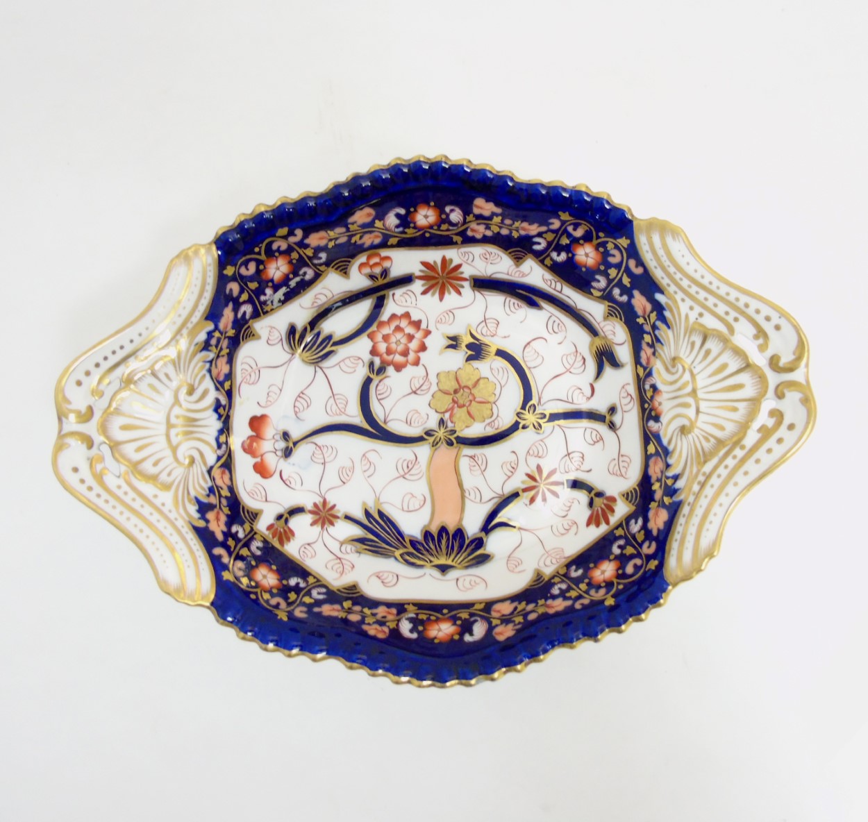 A Copeland Spode two handled serving dish with hand painted Imari decoration having gilt scroll