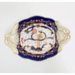 A Copeland Spode two handled serving dish with hand painted Imari decoration having gilt scroll