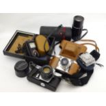 A quantity of vintage cameras and photographic equipment,