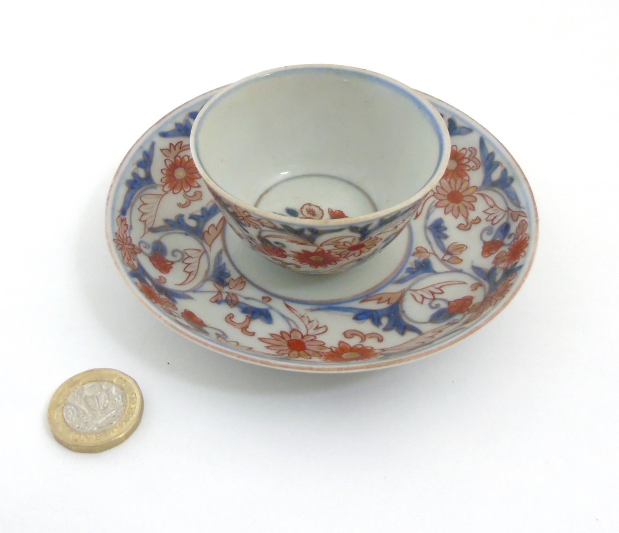 A Japanese Imari cup and saucer,