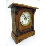 Fattorini and Sons mantel clock : a ' Patent Automatic Alarm ' oak cased 8 day clock striking on a