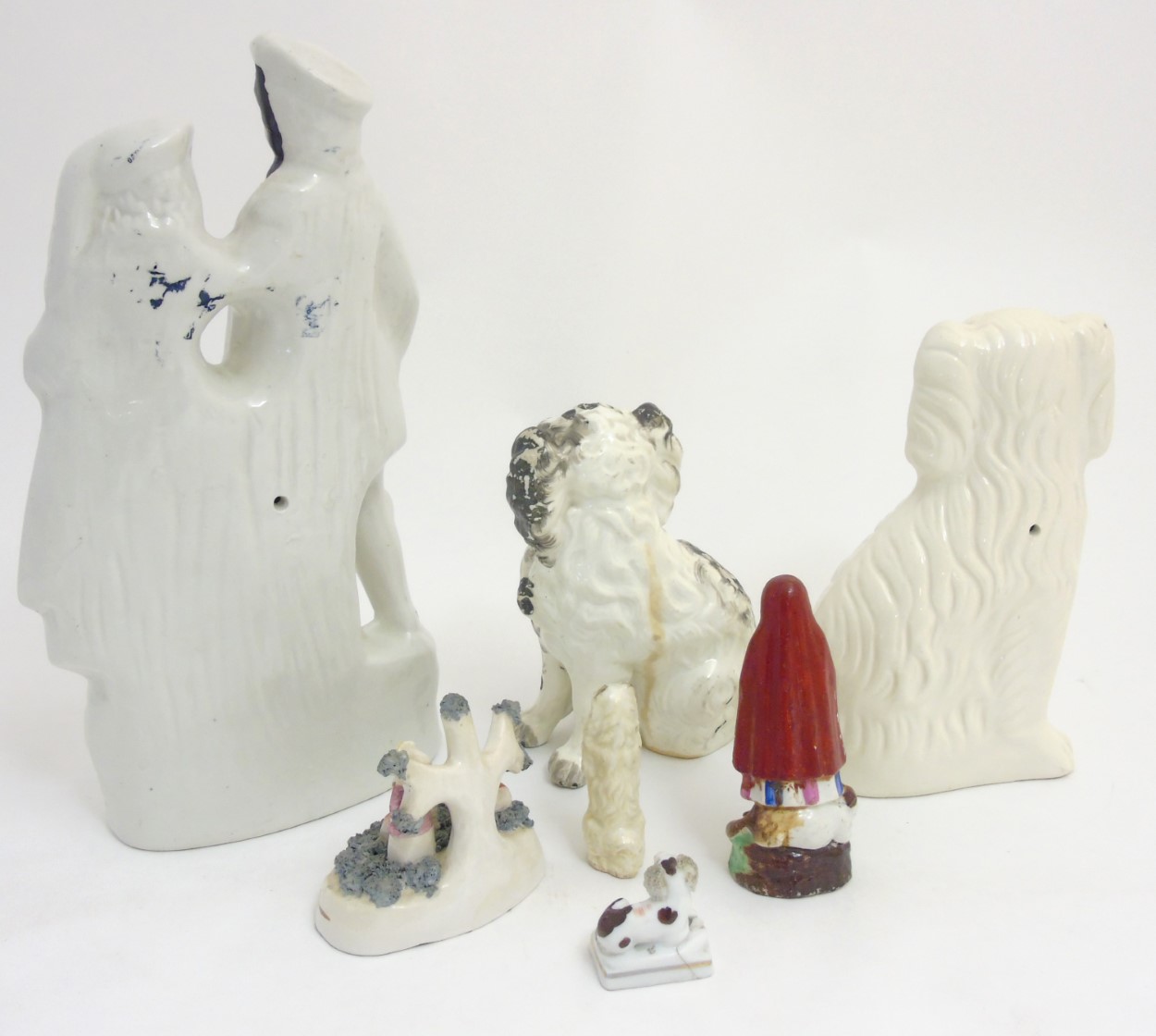A quantity of Staffordshire items comprising a Scottish couple, a figure and sheep group, - Image 4 of 7