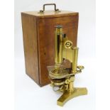 R & J Beck London 15668 : A monocular reflecting microscope with 2 spare eyepieces, lens etc,