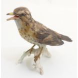 A Goebel bird figure of a Song Thrush CV115, in a matte finish, incised number to base,