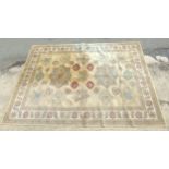 Rug / Carpet : Large carpet with beige ground, with floral and leaf designs, and roundels to centre,