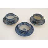 A set of three early 19thC pearlware transfer printed blue and white teacups / teabowl and saucers