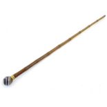 A bamboo walking cane / stick surmounted by agate knop and brass collar 36" long