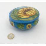 A Limited edition Moorcroft Sunburst circular lidded pot in Sunflower pattern by Vicky Lovatt ,