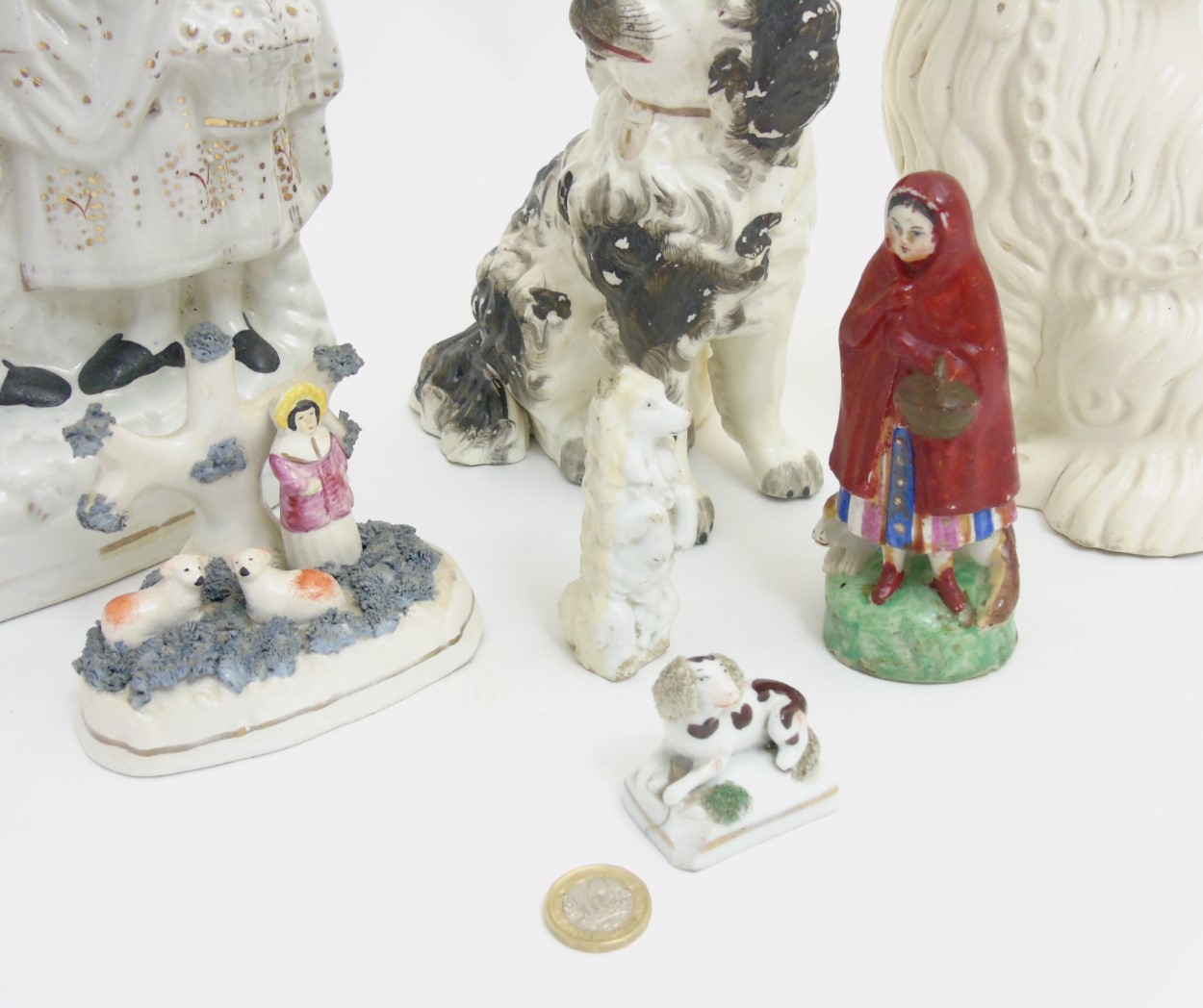 A quantity of Staffordshire items comprising a Scottish couple, a figure and sheep group, - Image 2 of 7