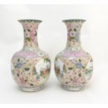 A pair of Chinese Famille Rose baluster vases,