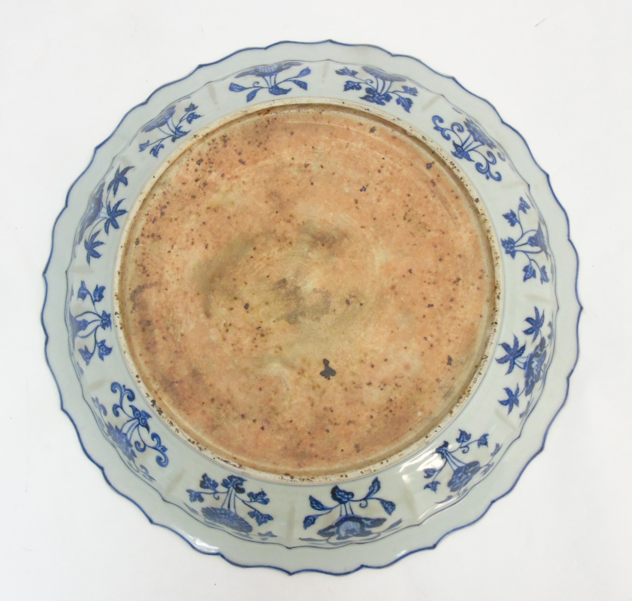 A Chinese blue and white 'Grape' dish / charger: A large Chinese charger with barbed rim, - Image 2 of 9