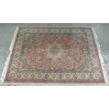 Rug/Carpet : an Indian hand made Woollen Kaimuri carpet with light rust ground having foliate